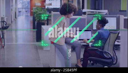 Discussing project over computer, colleagues in office with digital image overlay Stock Photo
