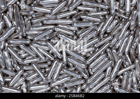 Shiny Silver Sugar Sprinkles Close-Up – Metallic Edible Candy Decorations for Baking, Cake Topping, Desserts, and Festive Pastries Stock Photo