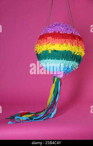 One colorful pinata on bright pink background Stock Photo - Alamy