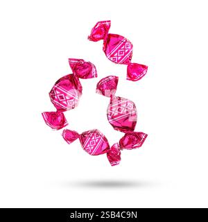 Candies in bright wrappers falling on white background Stock Photo