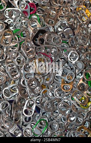 A pile of hundreds of drink tabs from aluminum soft drink (soda) and beer cans, removed and collected for recycling to raise money for charity. Stock Photo