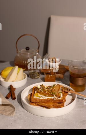 Breakfast with cream cheese toasts and caramelized pears, honey and walnuts Stock Photo