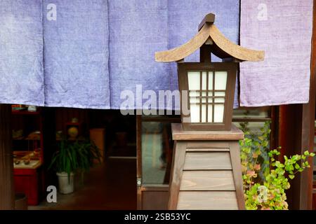 Traditional japanese wooden lantern in front of temple Stock Photo
