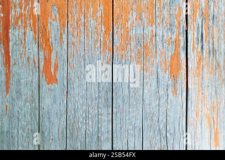 wooden panel with old orange paint Stock Photo