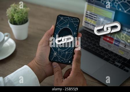 A person is typing on a laptop with a link to a website displayed on the screen. Backlinks Technology Online Web Businessman Stock Photo