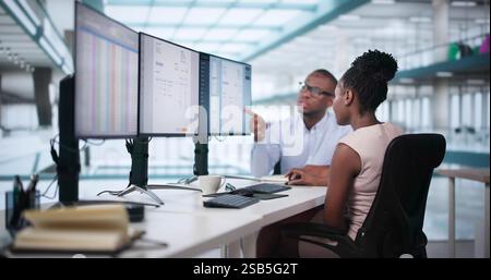 Analyst Working With Spreadsheet Business Data On Computer Stock Photo