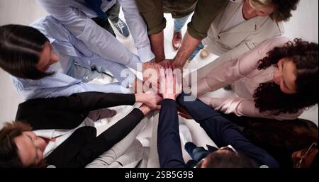 Diverse team of professionals collaborating in a business office environment. Stock Photo