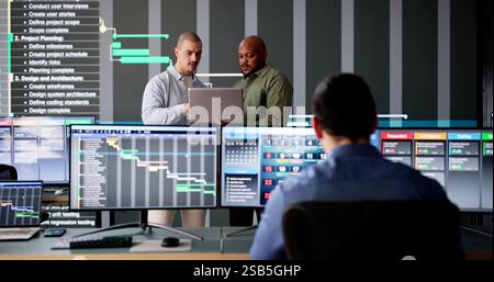 Diverse group of young professionals using digital agenda and calendar Stock Photo