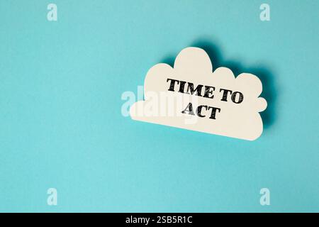 White cloud with the word time to act written on it. Concept of urgency and the need to take action Stock Photo