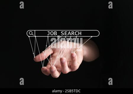 Job search. Woman holding virtual search bar on black background, closeup Stock Photo