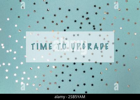 Blue background with a lot of stars and the words Time to Upgrade written in white Stock Photo