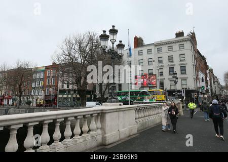 Dublin, Ireland - 22nd January 2025 - the footpath on O'Connell Bridge with the bridge lamps visible in the background Stock Photo