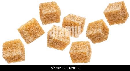 Falling cubes of cane sugar isolated on white background Stock Photo