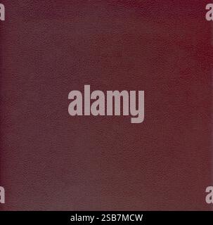 Dark-red surface of thick paper or cardboard in glued braid, background, texture. Backdrop of crimson surface with an embossed mesh pattern Stock Photo