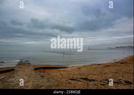 Margate Harbour seen from the sandy beach in a Winter day Stock Photo
