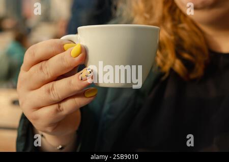 A cup of aromatic coffee held in hand. Lifestyle concept. Stock Photo