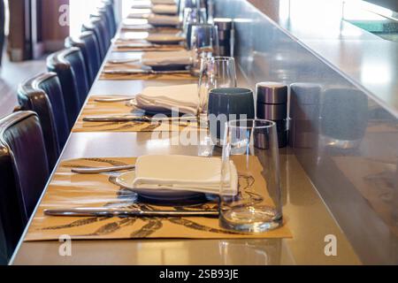 Miami Florida,Norwegian Cruise Line NCL Breakaway ship,11-day Caribbean Sea itinerary,onboard inside interior,modern dining setup,restaurant tableware Stock Photo