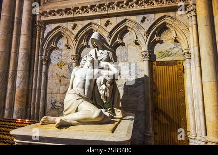 Pietà statue depicting the Virgin Mary cradling the dead body of Jesus ...