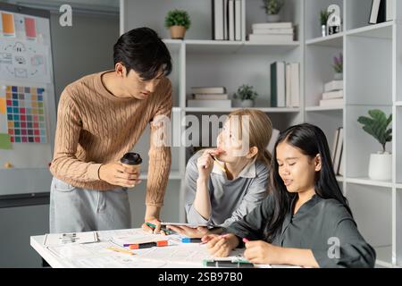 Collaborative UX UI design session with team discussing concepts and enjoying coffee. Stock Photo