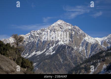Majestic Snow-Covered Mountain Peak with Forest in Kalam, Pakistan Stock Photo