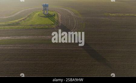 The sun rises behind Chesterton windmill in Warwickshire. Picture date: Sunday February 2, 2025. Stock Photo