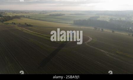 The sun rises behind Chesterton windmill in Warwickshire. Picture date: Sunday February 2, 2025. Stock Photo