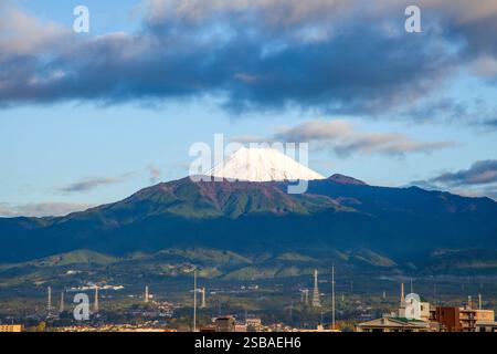Snow-capped peak of Mount Fuji as viewed from Numazu City in Shizuoka Prefecture, Japan. Stock Photo
