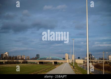 Embankment along Sava river and Adriatic Bridge in distance, Zagreb, Croatia Stock Photo