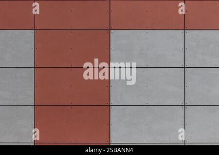 Red and Gray Tiled Wall Featuring Uniform Rectangle Cement Panels Stock Photo