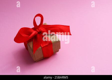 Beautiful gift box with red bow Stock Photo