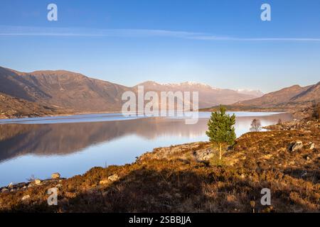 Loch Cluanie is a loch in the Northwest Highlands of Scotland at the south-east end of Glen Shiel. Stock Photo