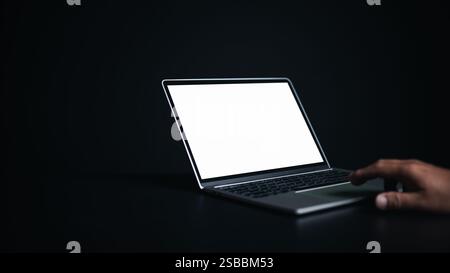 Workspace dark background new project on laptop computer with blank copy space screen for your advertising text message, Laptop with blank screen and Stock Photo