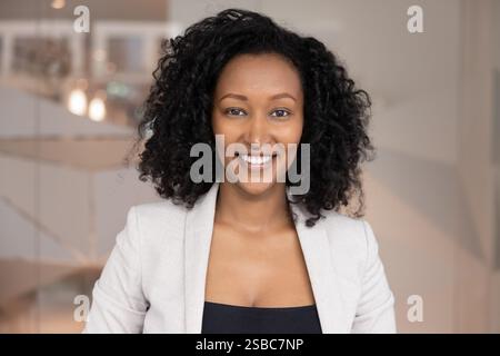 Positive beautiful African American businesswoman looking at camera Stock Photo