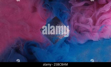 Art decoration. Smoke glitter ink. Bright blue pink purple colorful flow cube cloud paint vapor on abstract shimmering background. Stock Photo