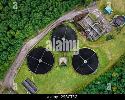 An aerial view directly above a waste water treatment works with ...