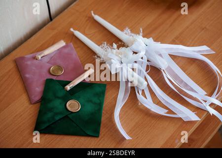 Elegant Wedding Invitations and Decor Items on Wooden Table. Stock Photo