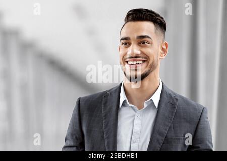 Portrait Of Happy Arab Man With Digital Tablet Standing At Airport Terminal Stock Photo