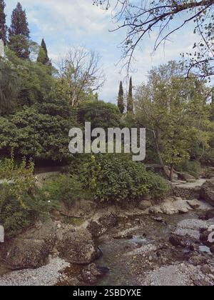 A historical site with stone buildings in the forest by the river in the capital of Montenegro, Podgorica Stock Photo