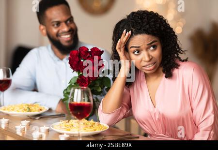 Black Woman On Unsuccessful First Date In Restaurant Stock Photo