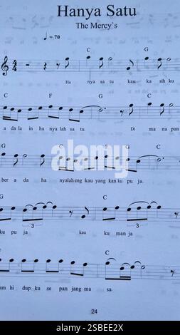 Handwritten Music Notebook with Musical Notation, Chords and Song Lyrics Stock Photo