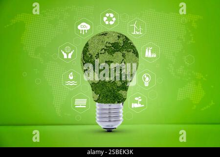 Renewable Energy. Environmental protection, renewable, sustainable energy sources. Green world map on the light bulb on green background with icons en Stock Photo