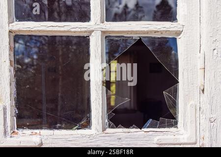 Window with broken glass on a croft Stock Photo