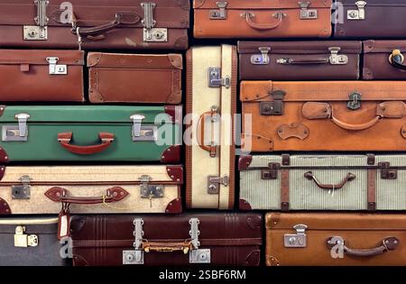 Pile of old suitcases and travel bags Stock Photo