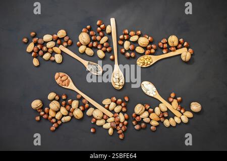 xed Nuts, dried fruits on rustic table, different kind of healthy food Stock Photo