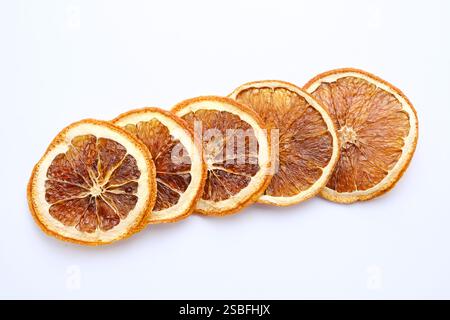 Dried orange slices on white background Stock Photo