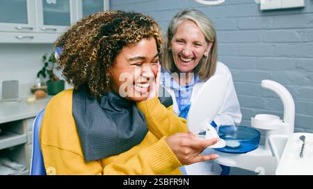 Smiling Patient and Dentist Share a Moment of Joy in a Dental Office Stock Photo