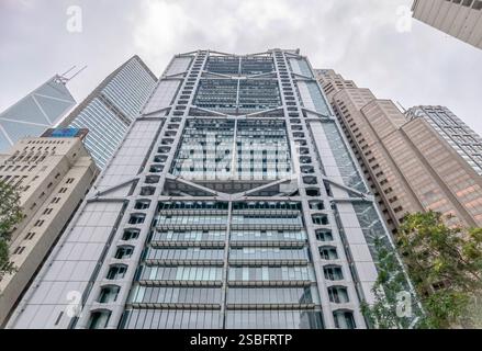 Hong Kong, China - February 01, 2025 : A low-angle close-up view of a modern skyscraper in Hong Kong's central business district.  The building showca Stock Photo