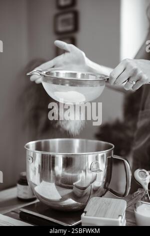 Artisan Baker Sieving Flour for Making Bread Stock Photo