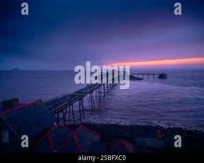 A ruined pier, Birnbeck Pier, in Weston-Super-Mare, at sunset after a winter storm Stock Photo