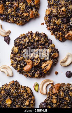 Healthy vegan quinoa cookies with nuts and chocolate, top view. Stock Photo